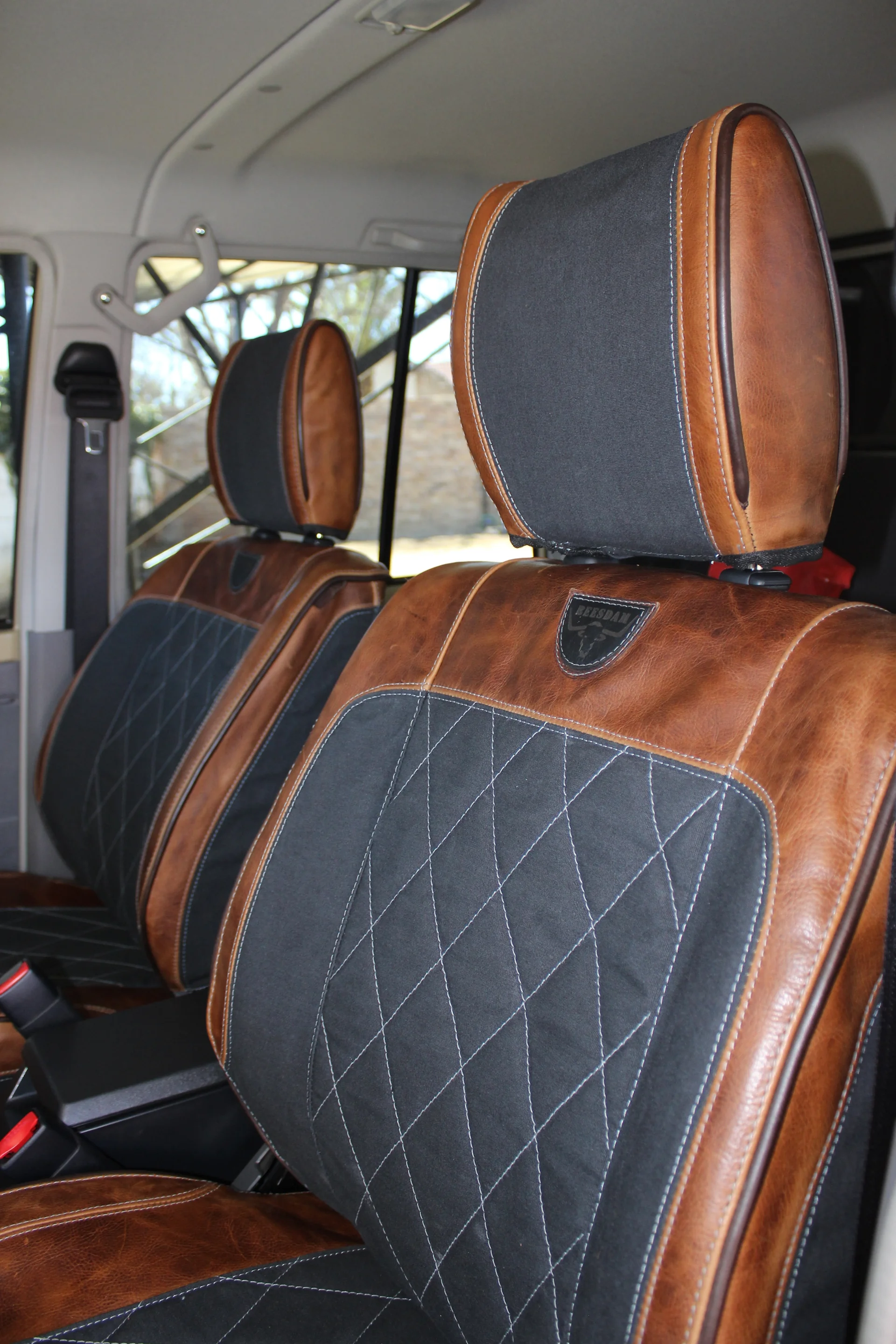 Dark brown leather-look car interior seats with tailored cover fit