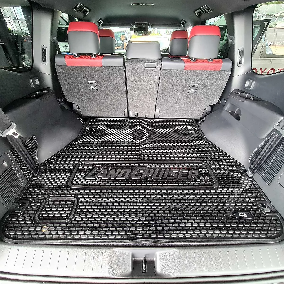 Custom-fit rubber boot liner fitted in an SUV load bay