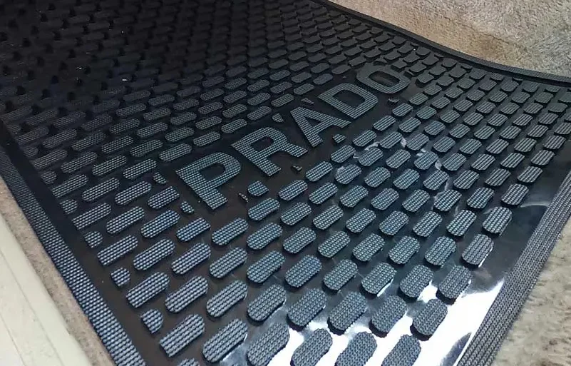 Vehicle interior carpet protection mat laid over the floor